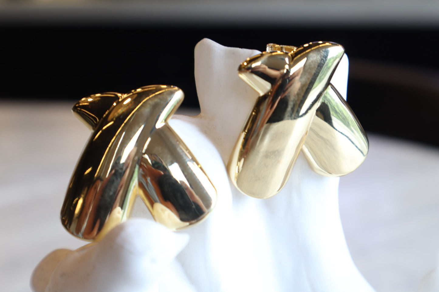 Intersect with style. Our 18K gold-filled X earrings are a bold and modern statement.