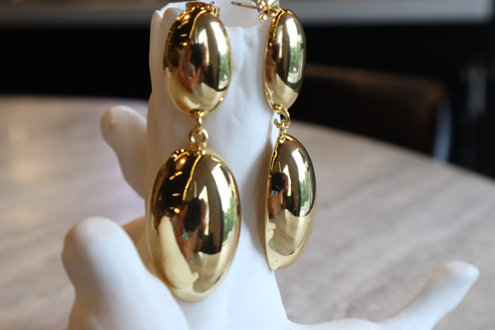 Indulge in timeless sophistication with our 18K Gold Filled Solid Oval Drop Earrings. The lustrous gold and graceful curves exude refined elegance.