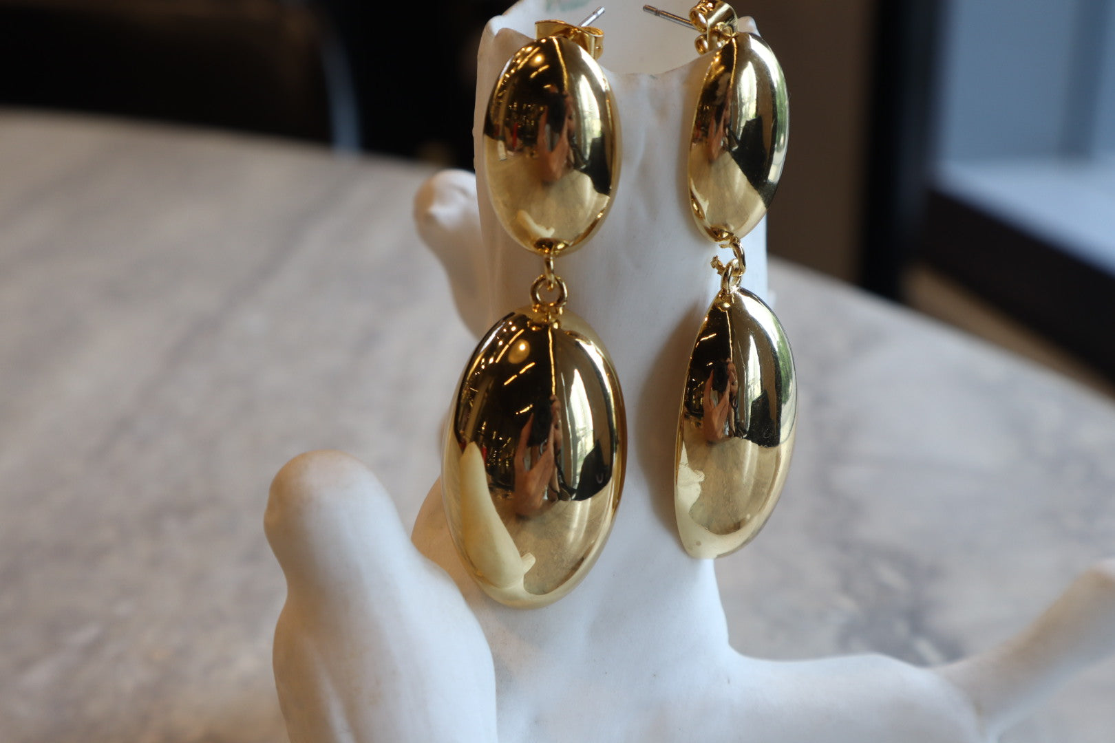 Indulge in timeless sophistication with our 18K Gold Filled Solid Oval Drop Earrings. The lustrous gold and graceful curves exude refined elegance.