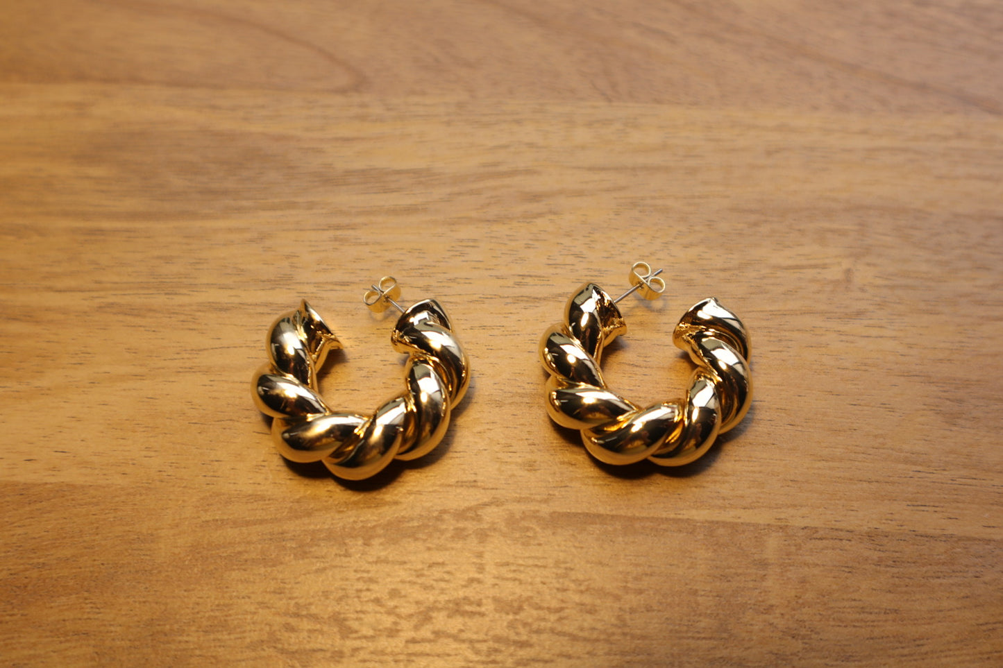 Intricate yet effortless. Discover the allure of our 18K gold-filled twisted hoop earrings.