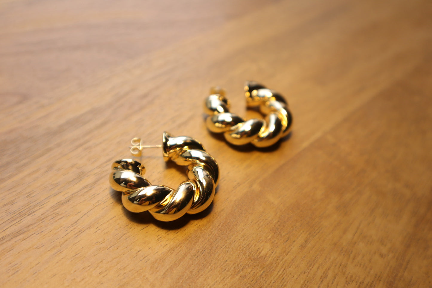 Intricate yet effortless. Discover the allure of our 18K gold-filled twisted hoop earrings.