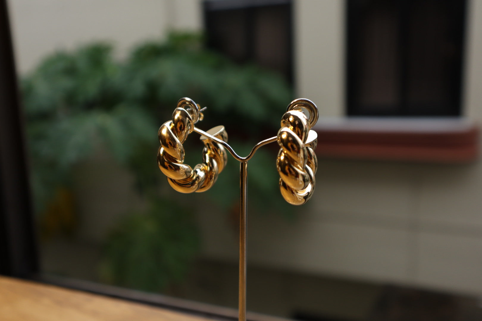 Intricate yet effortless. Discover the allure of our 18K gold-filled twisted hoop earrings.