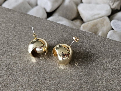 Playful elegance. Discover the charm of our 18K Gold Filled Ball in Ball Earrings.