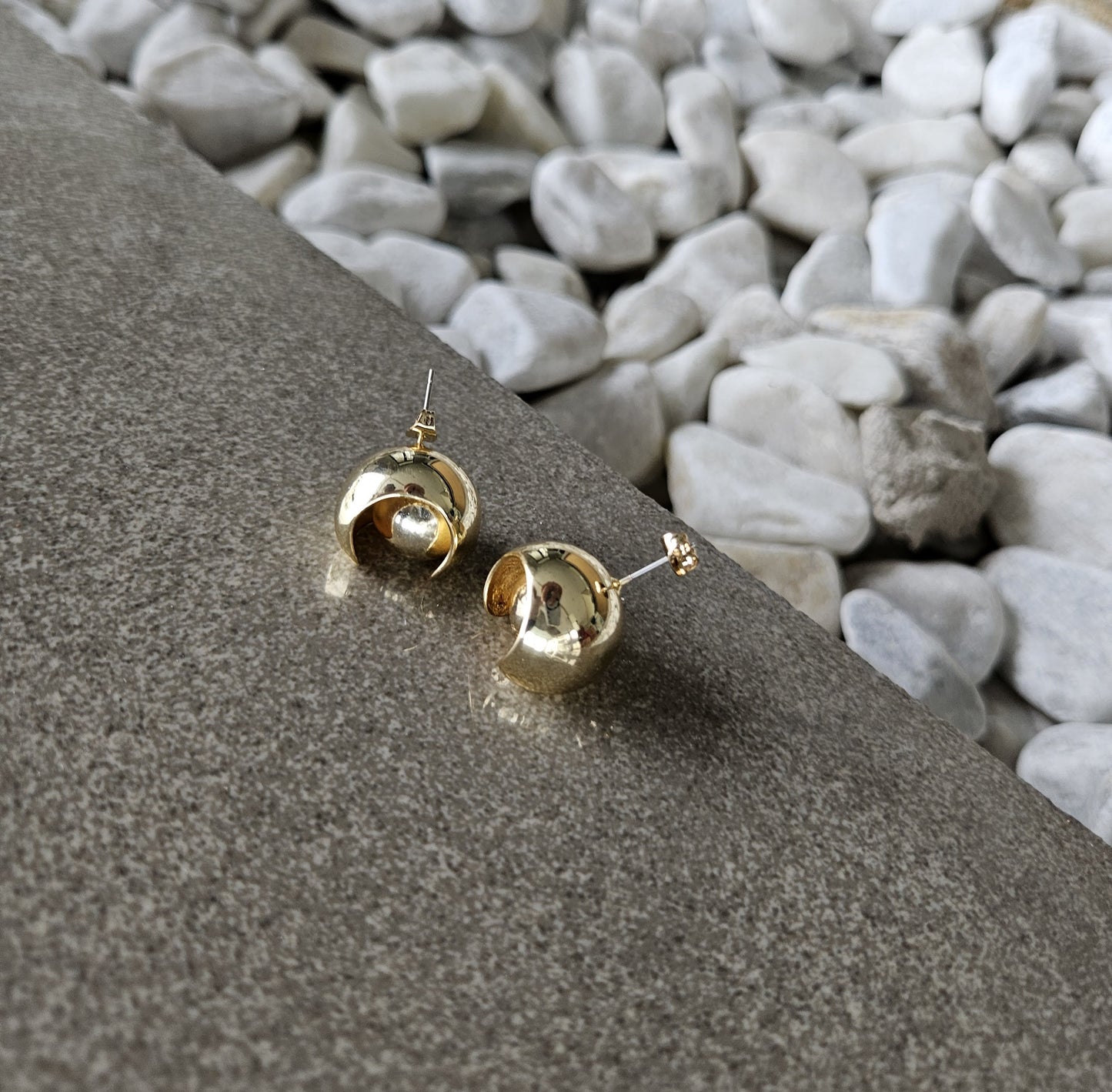 Playful elegance. Discover the charm of our 18K Gold Filled Ball in Ball Earrings.