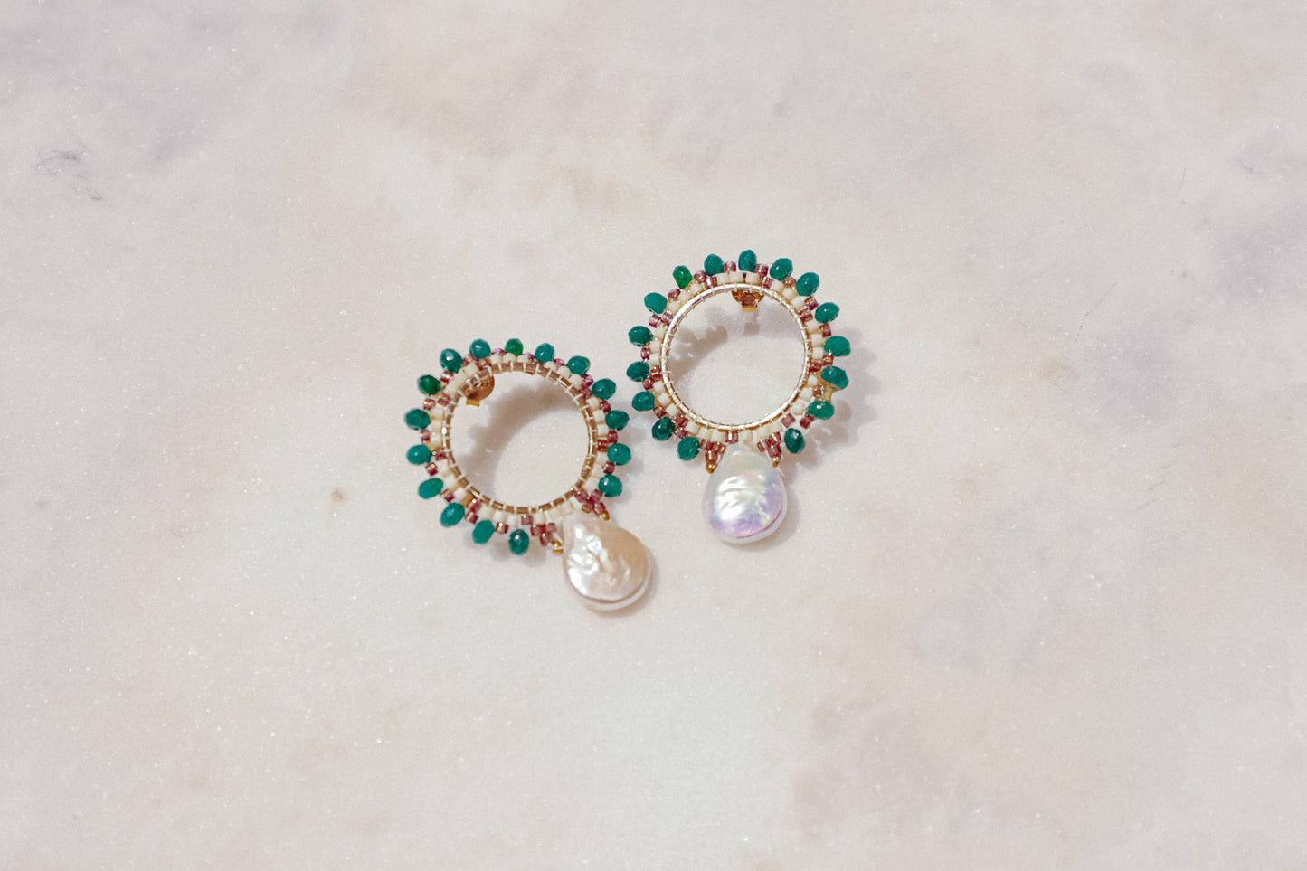 Baroque pearls find unexpected harmony with vibrant emerald agate rondelles in these unique gold-filled post earrings.