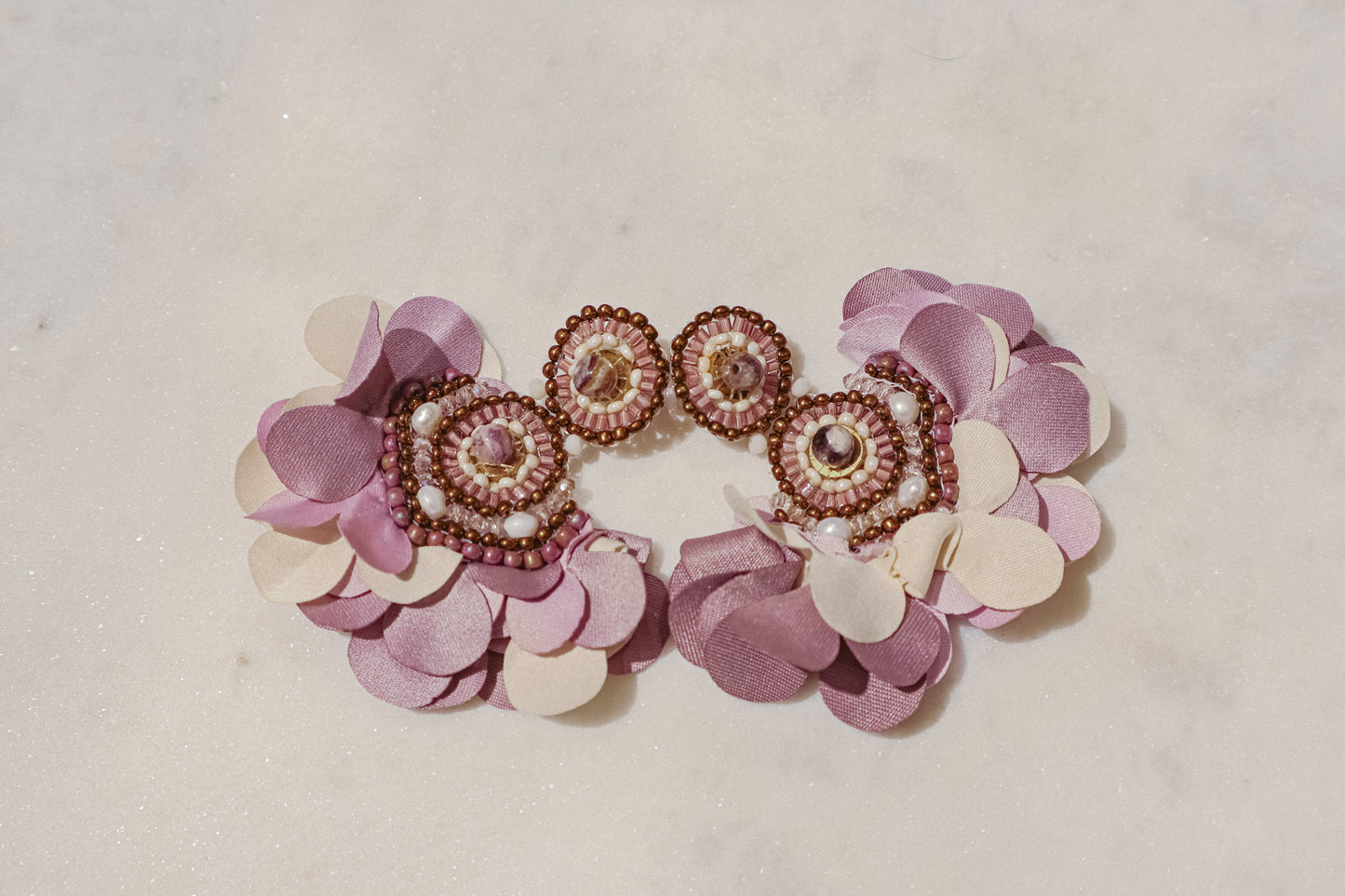 Fabric blooms meet the rich hues of amethyst and the classic elegance of pearls for a touch of timeless beauty on these Flower Fan earrings.