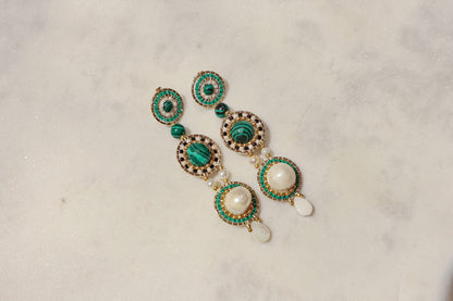 Freshwater pearls meet shimmering Miyuki beads and vibrant malachite, accented by delicate mother-of-pearl petals in gleaming gold-filled settings in these stand out earrings.