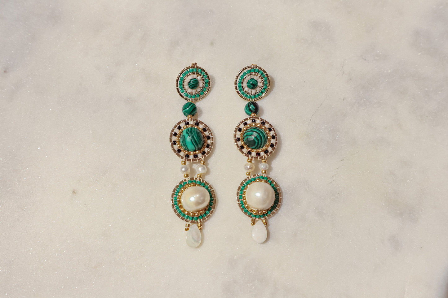 Freshwater pearls meet shimmering Miyuki beads and vibrant malachite, accented by delicate mother-of-pearl petals in gleaming gold-filled settings in these stand out earrings.