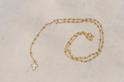 A touch of grace. 18k rose gold-filled rosary necklace with a beautiful mother-of-pearl cross.