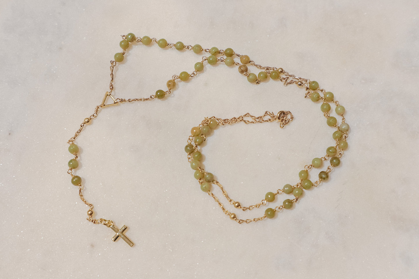 A pixie's prayer. Gold-filled rosary featuring petite turquoise beads for a touch of whimsical faith.