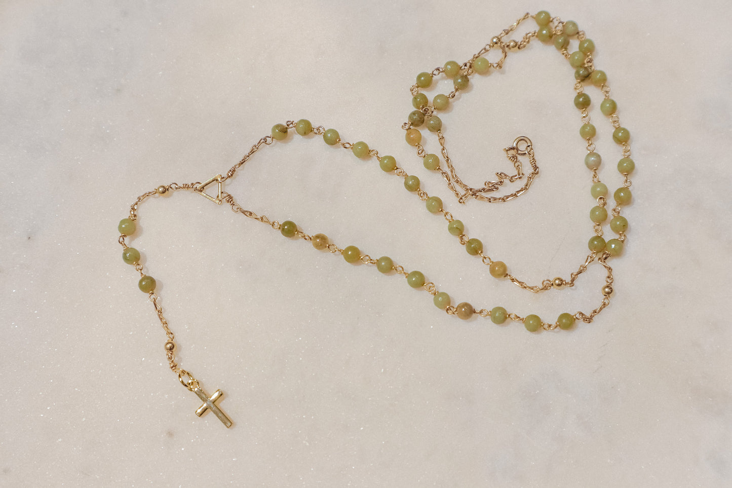 A pixie's prayer. Gold-filled rosary featuring petite turquoise beads for a touch of whimsical faith.