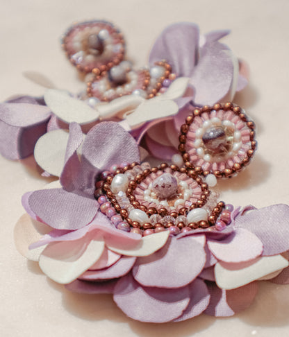 Fabric blooms meet the rich hues of amethyst and the classic elegance of pearls for a touch of timeless beauty on these Flower Fan earrings.