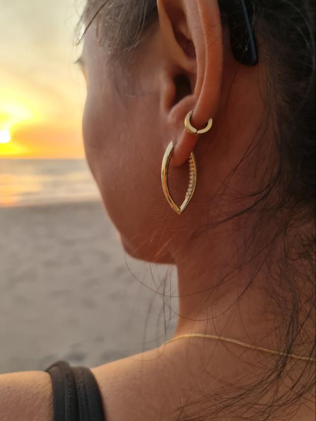 elegant uncommon edgy gold filled pointy hoops earrings worn in the beach