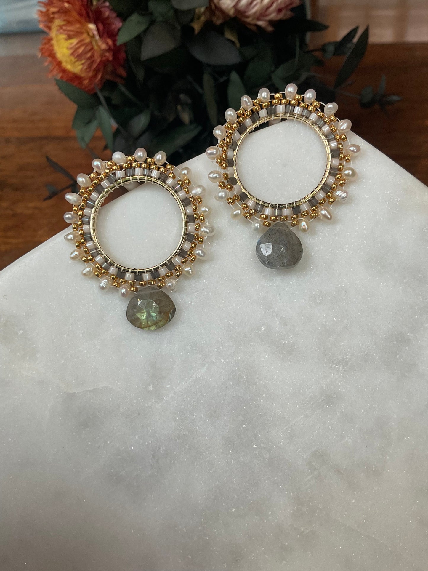 Front facing hoops with labaradorite drops and Keishi pearls woven around a goldfilled circle. 0.925 Sterling silver post  Each earring is 36mm in length and 30mm in width.