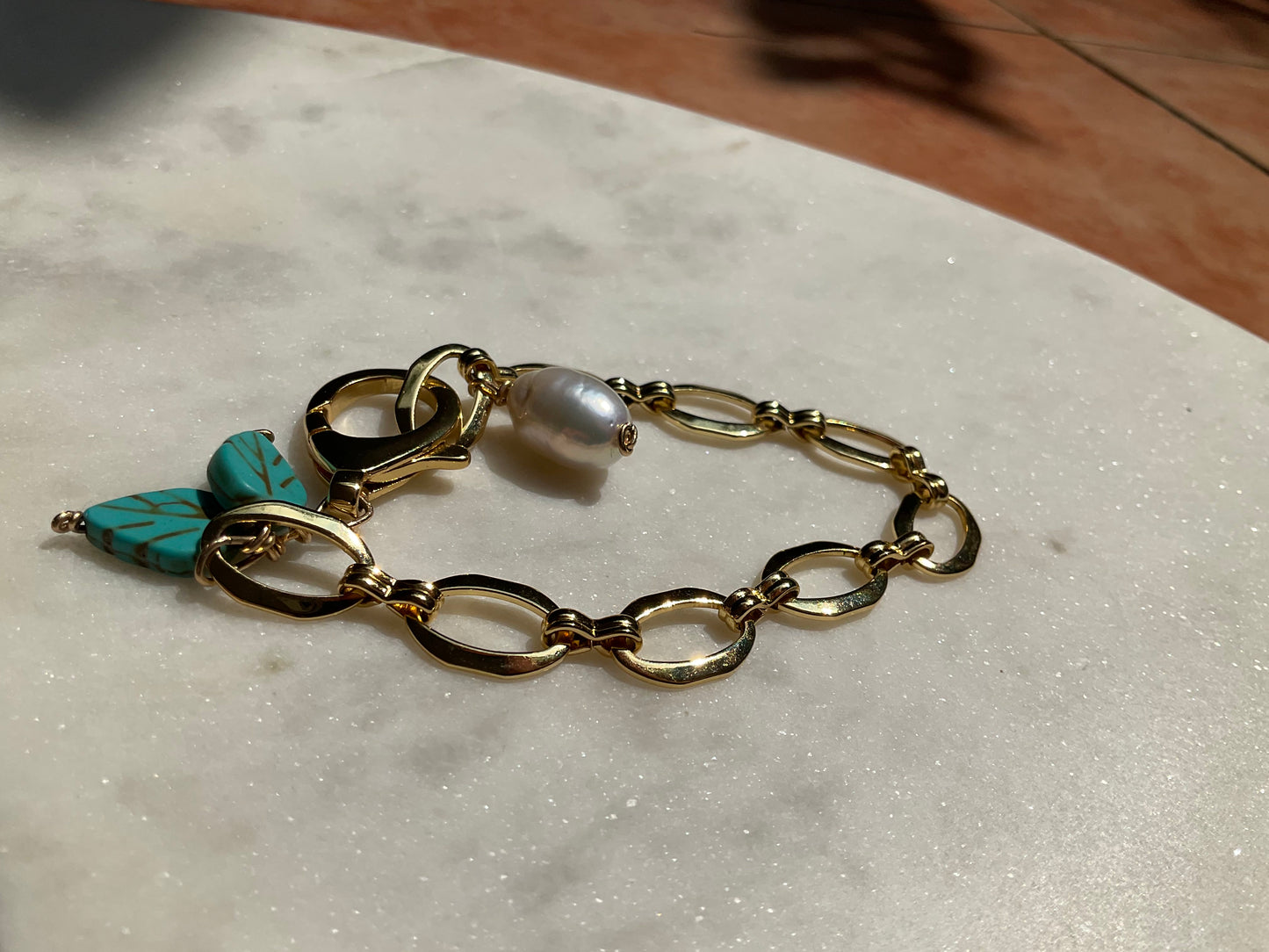 gold filled chunky chain bracelet with south sea baroque pearl and turquoise leaf